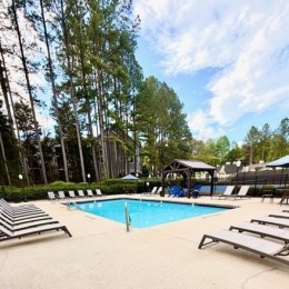 pool with a pavilion and lounge seating